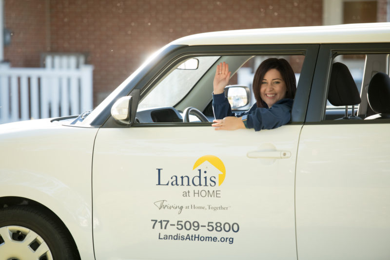 Caregiver waving from car